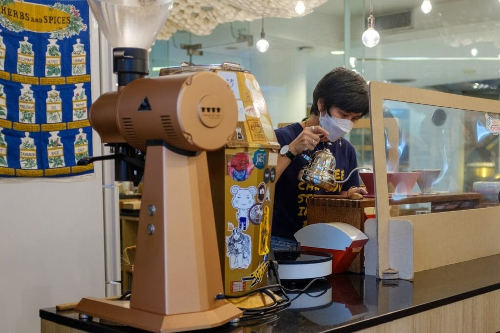 Barista with pouring kettle
