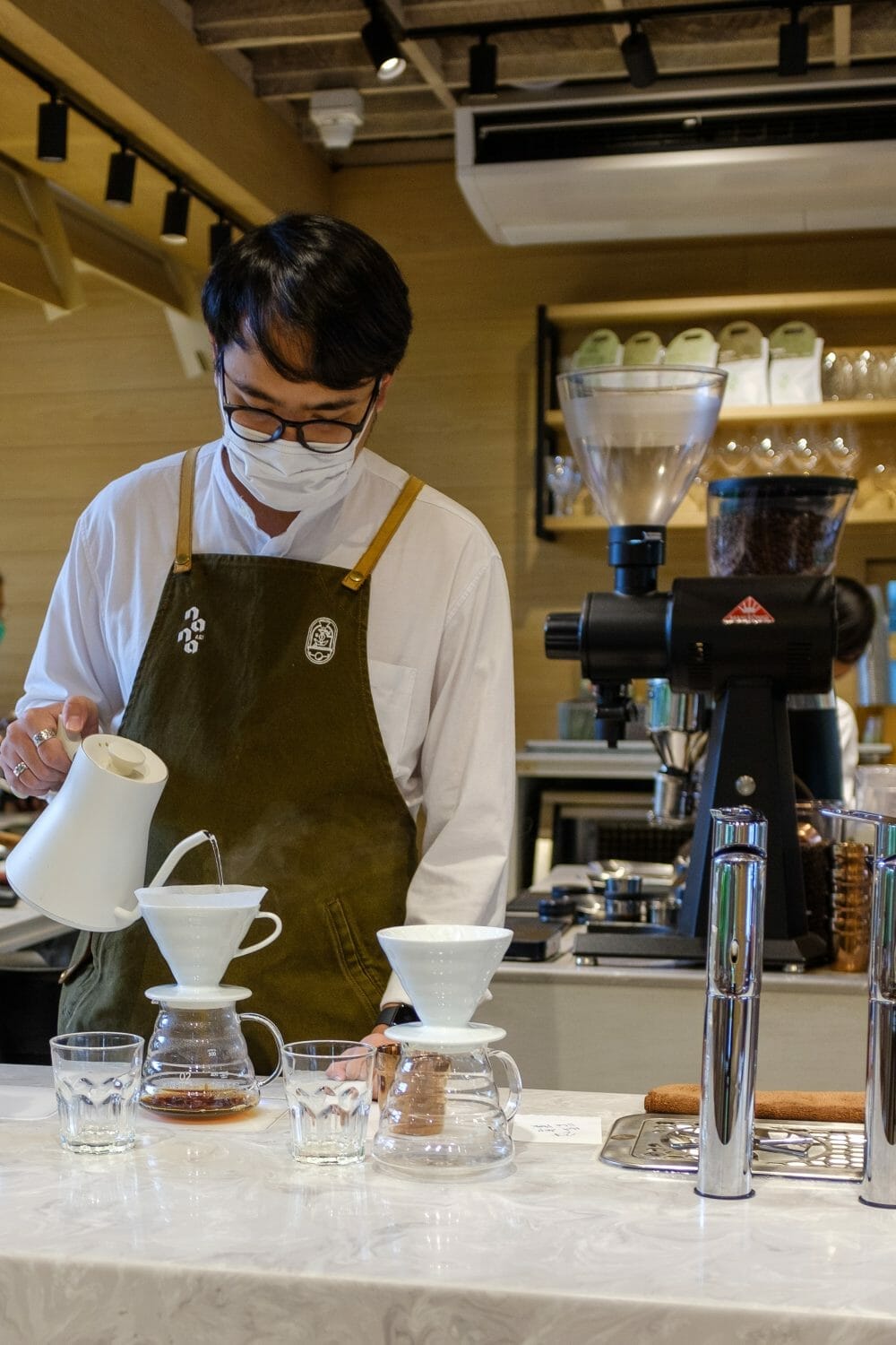 Barista brewing pourover